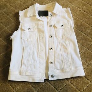 Sleeveless white AG jean vest.
